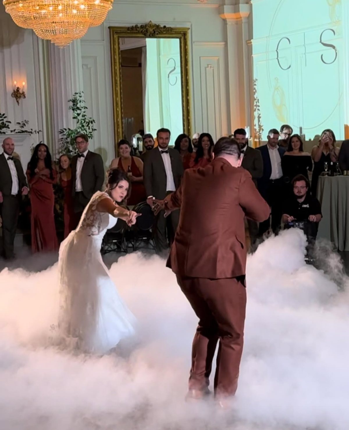 Low lying fog covering the floor around a couple during their first dance at a Dallas wedding